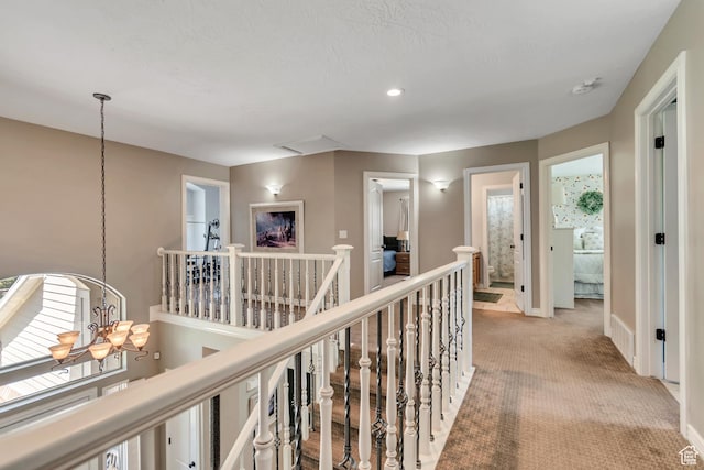 3065 W Current Creek Dr, South Jordan, UT 84095 - hallway with an upstairs landing, a chandelier, light colored carpet, and recessed lighting