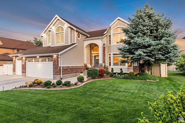 3065 W Current Creek Dr, South Jordan, UT 84095 - view of front of house with a garage, driveway, brick siding, and roof with shingles