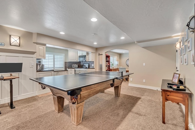 3065 W Current Creek Dr, South Jordan, UT 84095 - rec room with light carpet, arched walkways, recessed lighting, and a textured ceiling