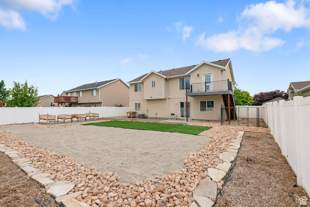 1226 N 3020 W, Provo, UT 84601 - rear view of house featuring stucco siding, a balcony, a fenced backyard, a residential view, and a patio