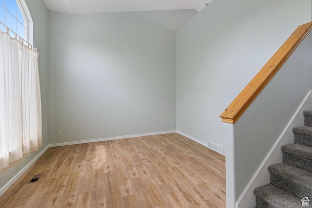 1226 N 3020 W, Provo, UT 84601 - spare room featuring light wood-style flooring, stairway, and vaulted ceiling