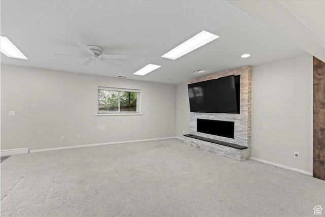 8022 S Deer Creek Rd E, Cottonwood Heights, UT 84121 - unfurnished living room featuring a fireplace, carpet, a ceiling fan, and recessed lighting