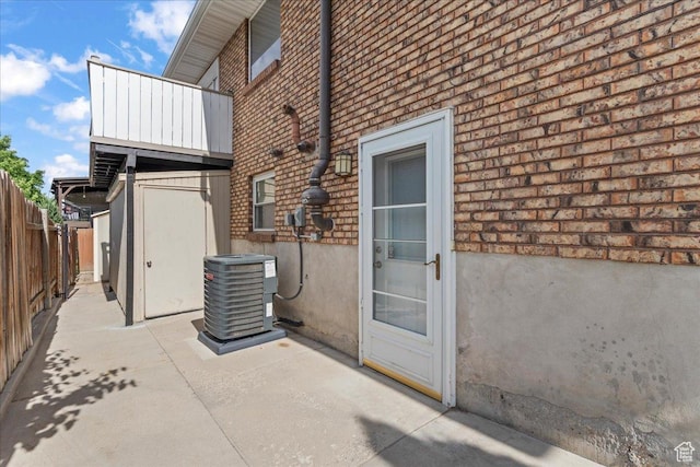 8022 S Deer Creek Rd E, Cottonwood Heights, UT 84121 - doorway to property with brick siding and a patio area