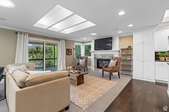 8022 S Deer Creek Rd E, Cottonwood Heights, UT 84121 - living area with crown molding, a skylight, a glass covered fireplace, dark wood-style flooring, and recessed lighting