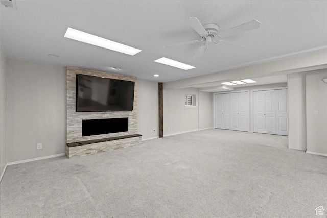 8022 S Deer Creek Rd E, Cottonwood Heights, UT 84121 - finished basement featuring carpet flooring, a fireplace, and a ceiling fan