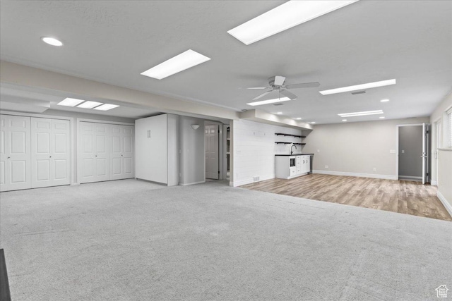 8022 S Deer Creek Rd E, Cottonwood Heights, UT 84121 - unfurnished living room with carpet, ceiling fan, and recessed lighting