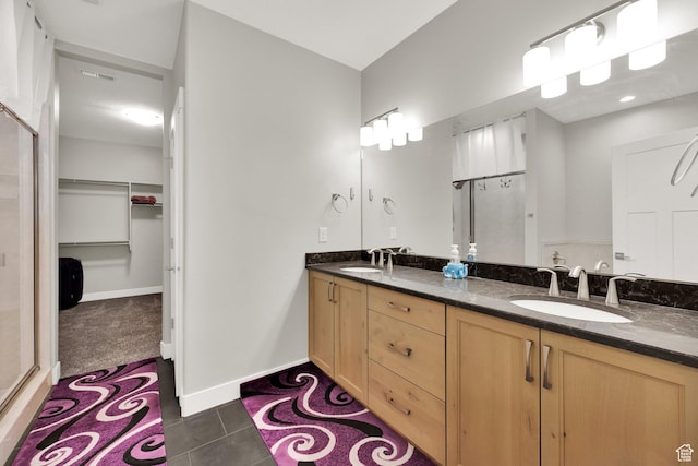 1016 N Vista Loop, Morgan, UT 84050 - full bathroom featuring double vanity, a spacious closet, tile patterned flooring, and a shower with shower door