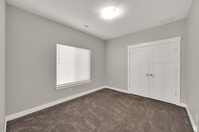 1016 N Vista Loop, Morgan, UT 84050 - unfurnished bedroom with dark colored carpet and a closet