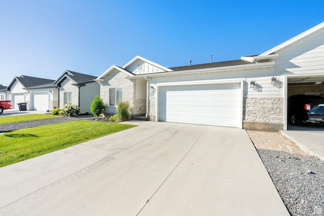 1016 N Vista Loop, Morgan, UT 84050 - view of front of property featuring stone siding, a garage, driveway, and a front yard