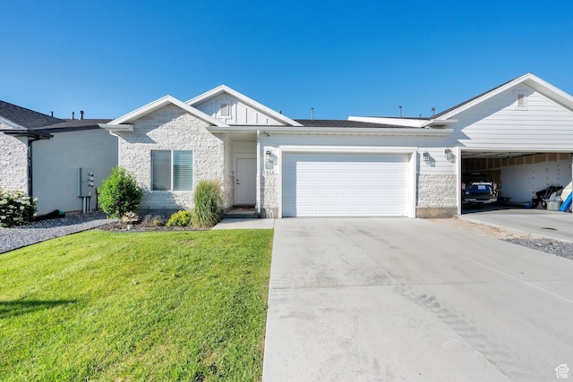 1016 N Vista Loop, Morgan, UT 84050 - view of front of home with stone siding, an attached garage, a front yard, driveway, and board and batten siding