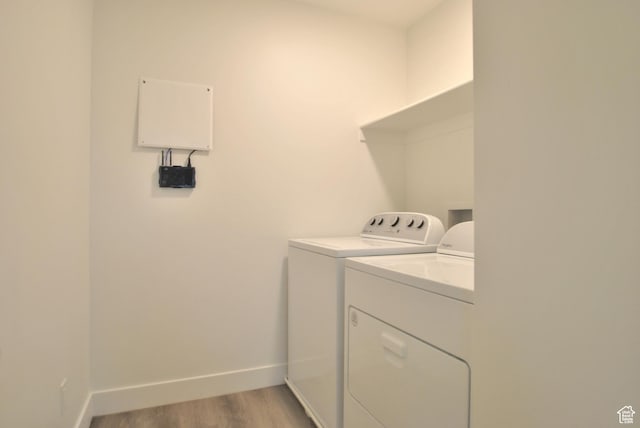 1183 W 1820 S, Logan, UT 84321 - laundry area featuring washer and dryer and light wood finished floors
