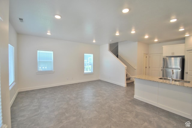 1183 W 1820 S, Logan, UT 84321 - unfurnished living room featuring recessed lighting, stairway, and tile patterned floors