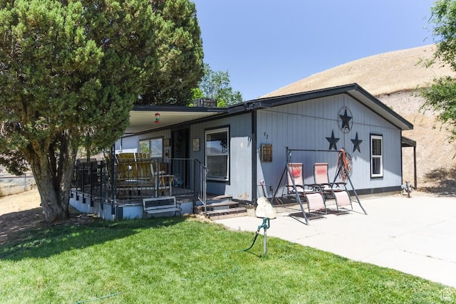 93 N Sherman St, Stockton, UT 84071 - back of house with a yard, covered porch, and a patio area