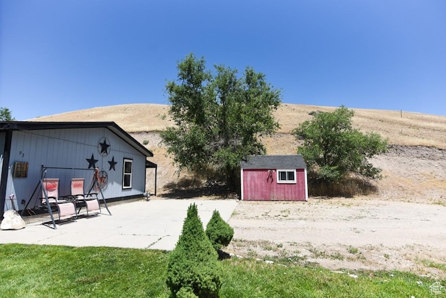 93 N Sherman St, Stockton, UT 84071 - view of yard with a storage shed and a patio area