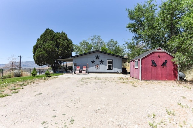 93 N Sherman St, Stockton, UT 84071 - view of front of house with a storage shed and a mountain view