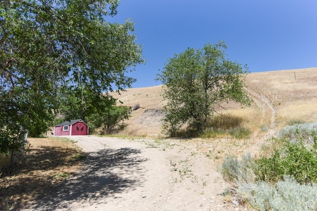 93 N Sherman St, Stockton, UT 84071 - view of dirt / gravel road featuring a rural view
