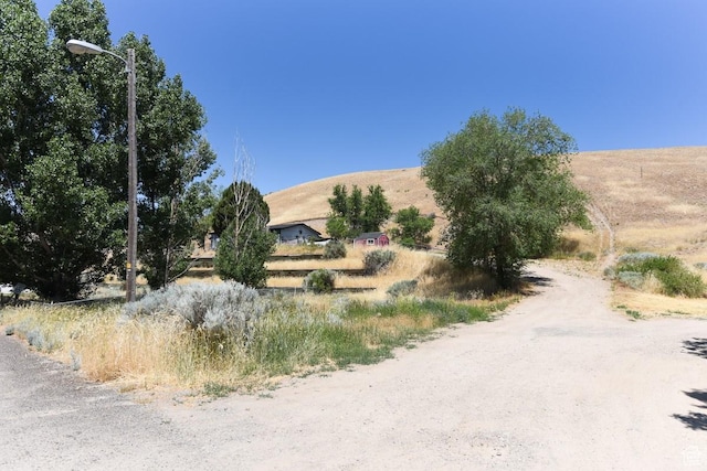 93 N Sherman St, Stockton, UT 84071 - view of dirt / gravel road with a view of rural / pastoral area and street lights