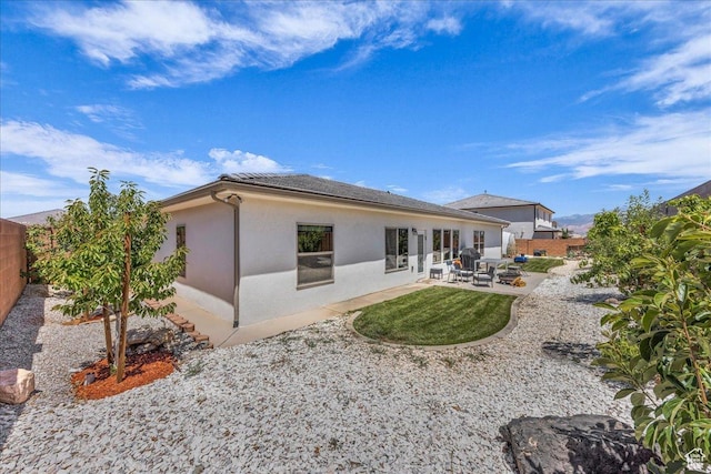 2811 S 3210 E, St George, UT 84790 - back of property with a patio area, stucco siding, and a fenced backyard