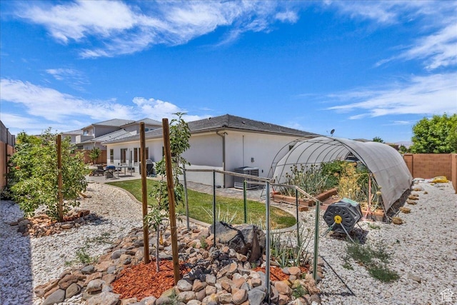 2811 S 3210 E, St George, UT 84790 - rear view of house featuring a patio area, a fenced backyard, and stucco siding