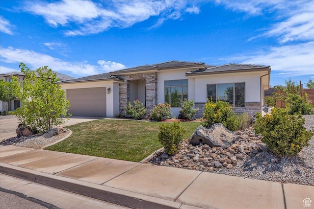 2811 S 3210 E, St George, UT 84790 - prairie-style house with stone siding, a garage, stucco siding, a front lawn, and driveway