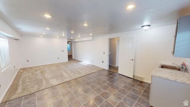 13333 S Alonzo Ln W, Herriman, UT 84096 - carpeted spare room featuring a sink and recessed lighting