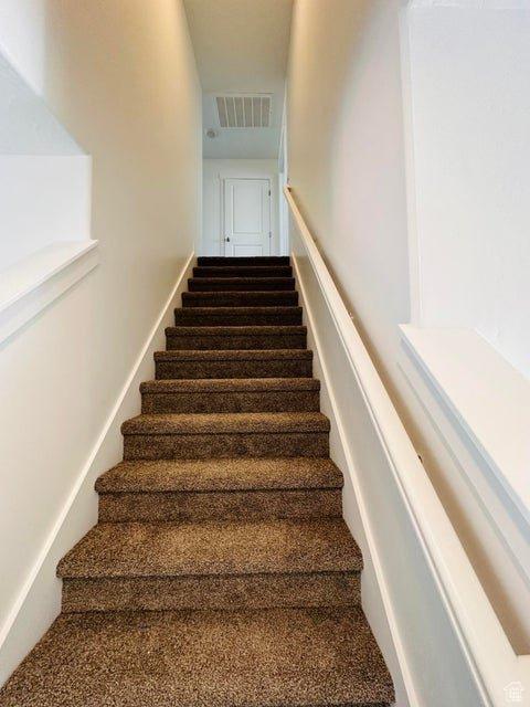2944 W Ezra Dr, Cedar City, UT 84720 - stairway featuring carpet flooring