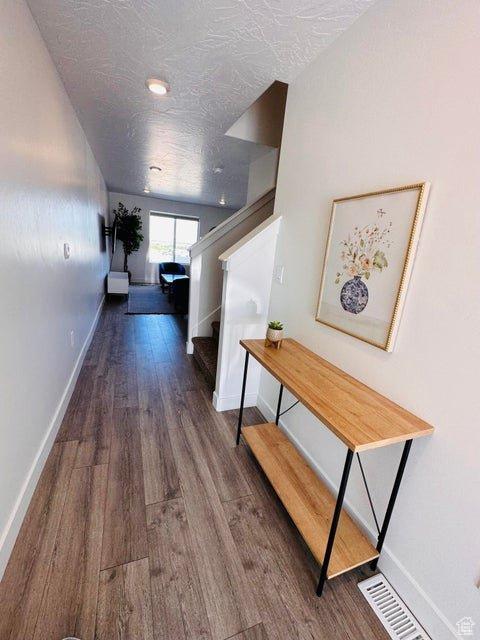 2944 W Ezra Dr, Cedar City, UT 84720 - hall featuring wood finished floors and stairway