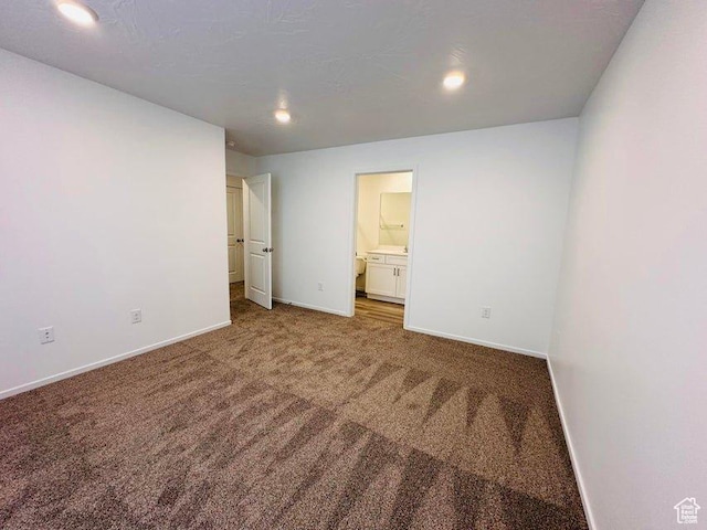 2944 W Ezra Dr, Cedar City, UT 84720 - unfurnished bedroom featuring carpet, ensuite bathroom, and recessed lighting