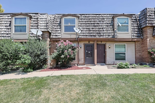 88 W 50 S Unit J8, Centerville, UT 84014 - view of front facade featuring mansard roof and a front lawn