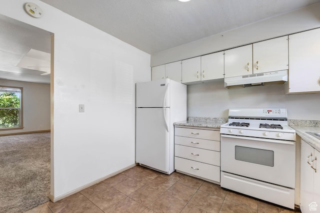 88 W 50 S Unit J8, Centerville, UT 84014 - kitchen featuring white appliances, under cabinet range hood, light countertops, and white cabinetry
