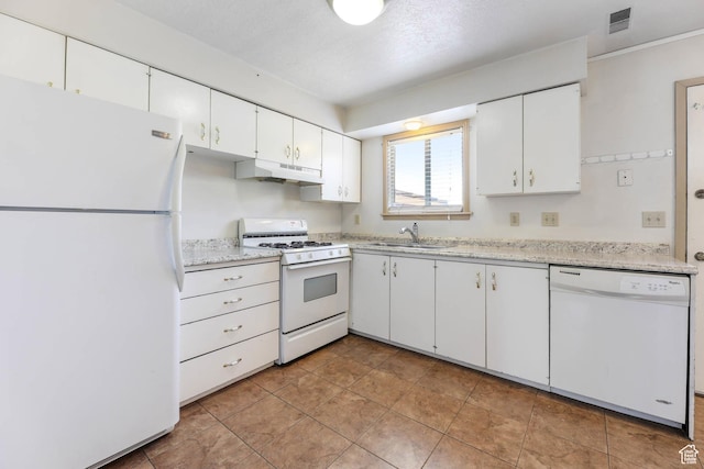 88 W 50 S Unit J8, Centerville, UT 84014 - kitchen featuring white appliances, under cabinet range hood, light countertops, and white cabinetry