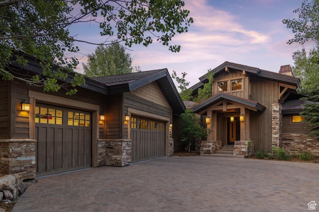 2711 E Bitter Brush Dr, Park City, UT 84098 - craftsman inspired home featuring stone siding, decorative driveway, and an attached garage