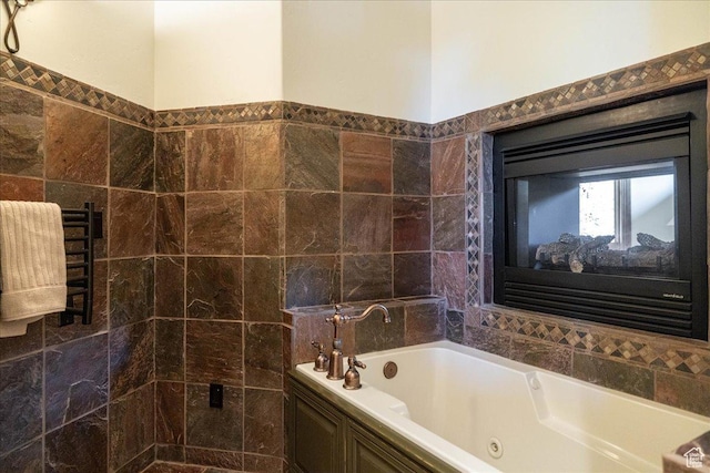 2711 E Bitter Brush Dr, Park City, UT 84098 - bathroom with a tub with jets, tile walls, and a towel warmer
