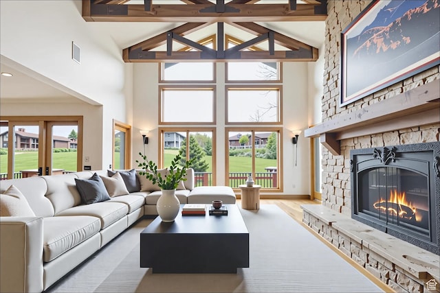 2711 E Bitter Brush Dr, Park City, UT 84098 - living area featuring high vaulted ceiling, a fireplace, beam ceiling, and wood finished floors