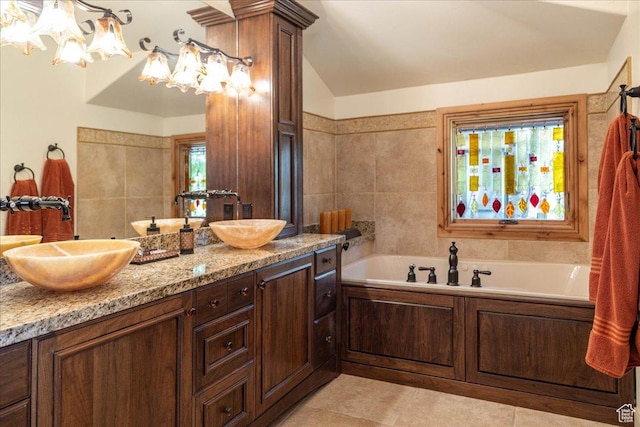 2711 E Bitter Brush Dr, Park City, UT 84098 - full bathroom with double vanity, a garden tub, a chandelier, and lofted ceiling