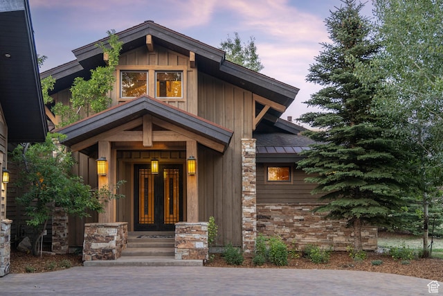 2711 E Bitter Brush Dr, Park City, UT 84098 - doorway to property with a standing seam roof, stone siding, a metal roof, and board and batten siding