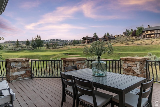 2711 E Bitter Brush Dr, Park City, UT 84098 - deck at dusk featuring view of golf course, outdoor dining space, and a yard