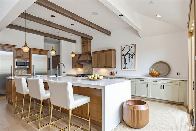 2711 E Bitter Brush Dr, Park City, UT 84098 - kitchen featuring stainless steel appliances, custom exhaust hood, tasteful backsplash, a large island with sink, and beam ceiling