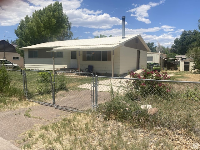 229 E 400 N, Duchesne, UT 84021 - view of front facade with a gate and a metal roof