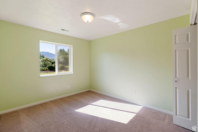 888 S Mallard Loop W, Logan, UT 84321 - carpeted spare room featuring baseboards and a mountain view