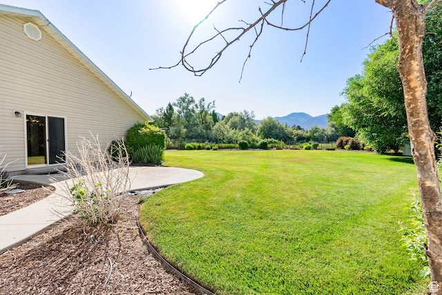 888 S Mallard Loop W, Logan, UT 84321 - view of green lawn with a mountain view and a patio