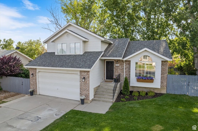 1153 N 280 W, American Fork, UT 84003 - view of front of home with brick siding, a shingled roof, driveway, and an attached garage