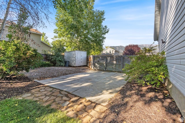 1153 N 280 W, American Fork, UT 84003 - fenced backyard featuring a storage shed, a patio area, and a gate