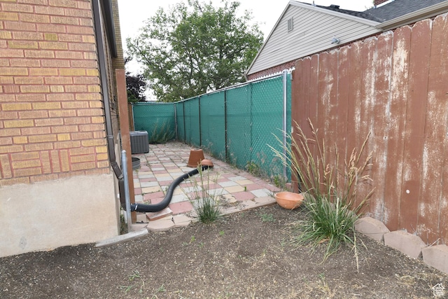 2758 Fowler Ave, Ogden, UT 84403 - fenced backyard with a patio area