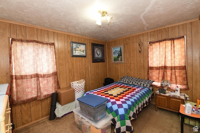 2758 Fowler Ave, Ogden, UT 84403 - carpeted bedroom featuring multiple windows, wooden walls, and a textured ceiling