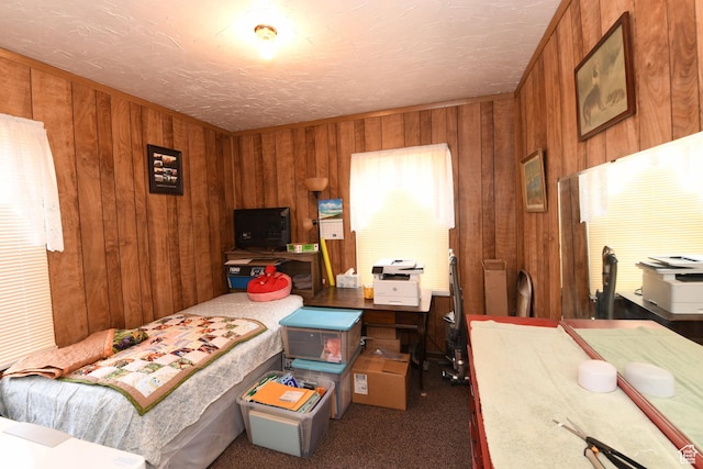 2758 Fowler Ave, Ogden, UT 84403 - carpeted bedroom featuring wood walls and a textured ceiling