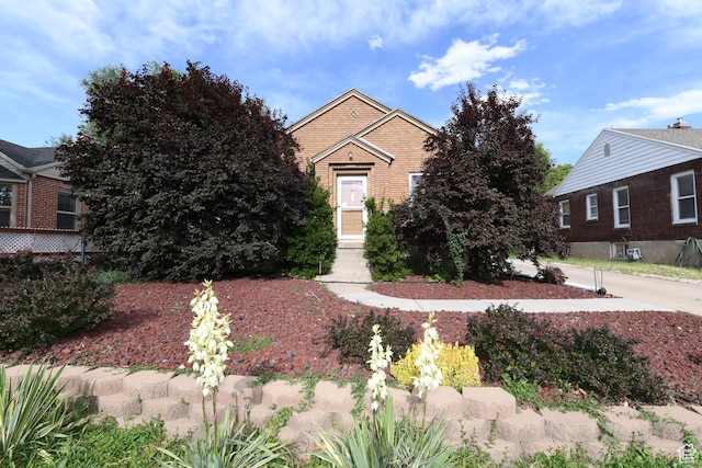 2758 Fowler Ave, Ogden, UT 84403 - view of property hidden behind natural elements featuring brick siding