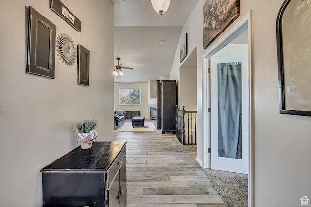 11645 S Keystone Dr, South Jordan, UT 84009 - hallway with light wood-type flooring and an upstairs landing