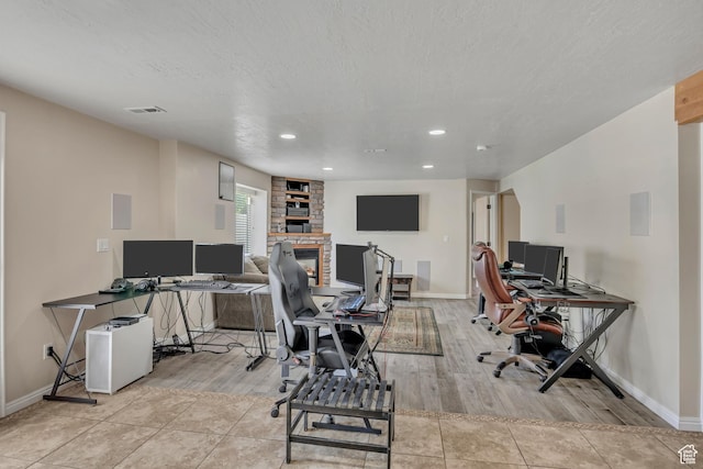 11645 S Keystone Dr, South Jordan, UT 84009 - home office with a fireplace, light wood finished floors, and recessed lighting