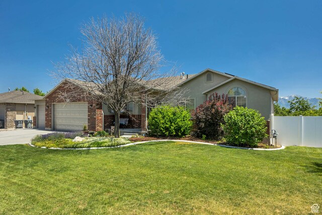 11645 S Keystone Dr, South Jordan, UT 84009 - ranch-style home featuring a garage, driveway, stucco siding, and brick siding